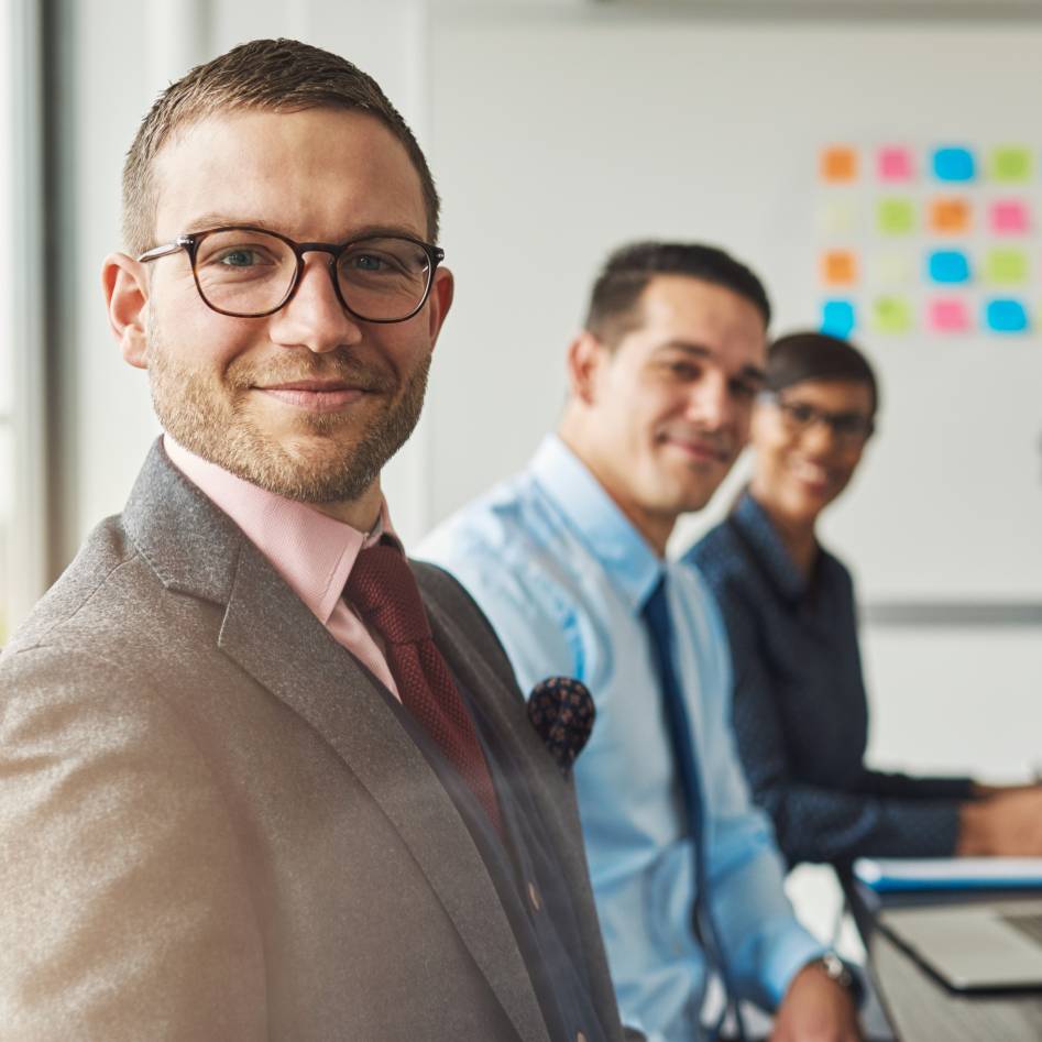 Smiling Businessman with Glasses and Beard